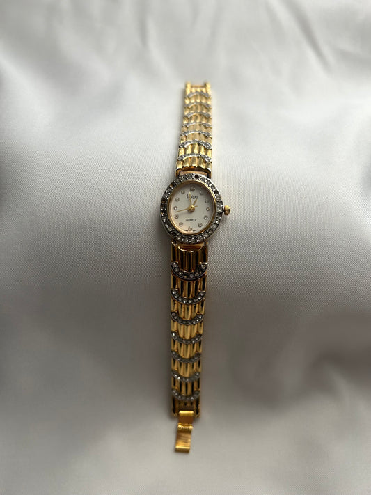 Gold Vivani watch with silver gemstones