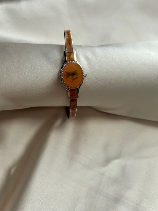 Orange peek a boo watch