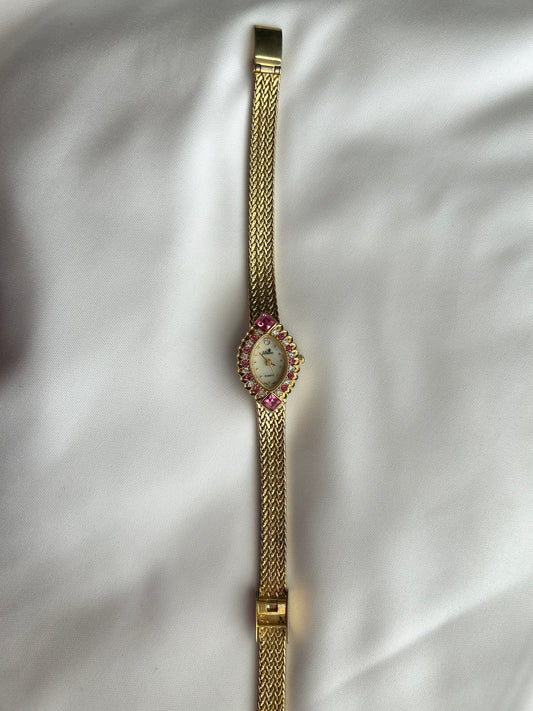 LA Express gold watch with pink gemstones